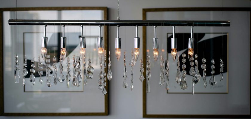 clear-glass-chandelier-turned-on-inside-room